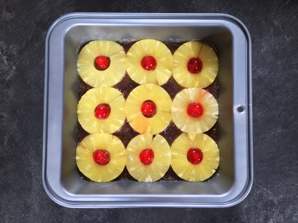 Pineapple rings and cherries in the pan