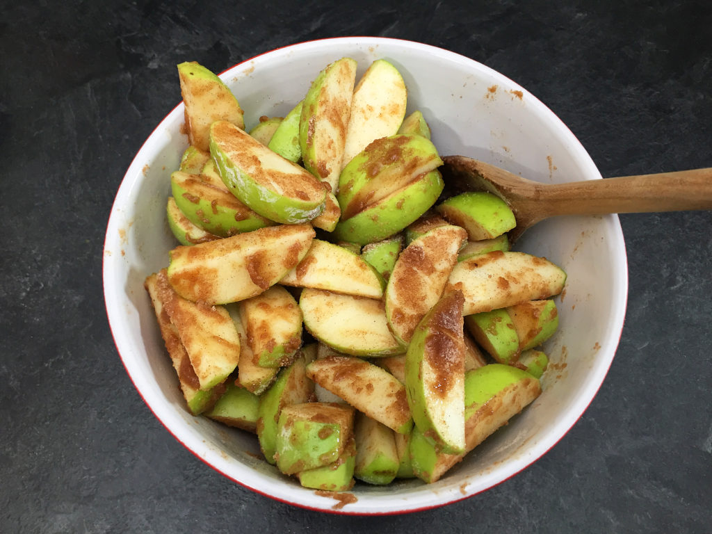 apple cobbler filling mixed in bowl