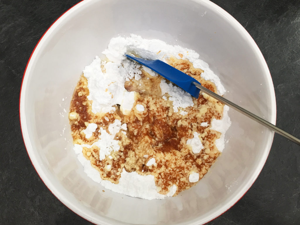 mixing the browned butter frosting