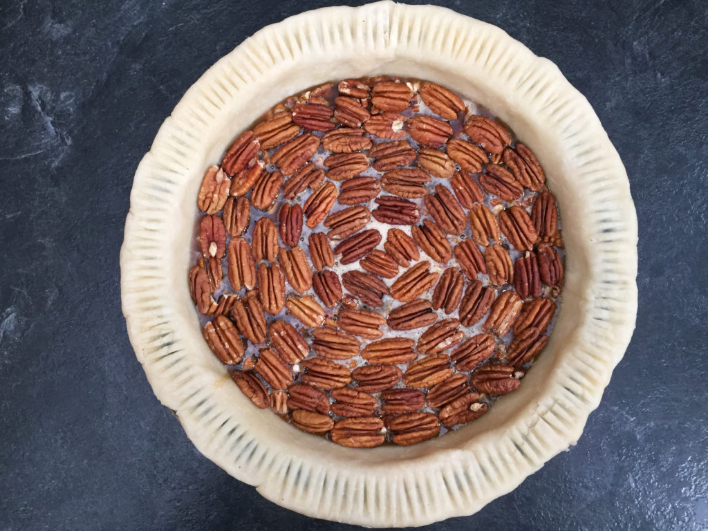 pecan pie with fork patterned crust edge