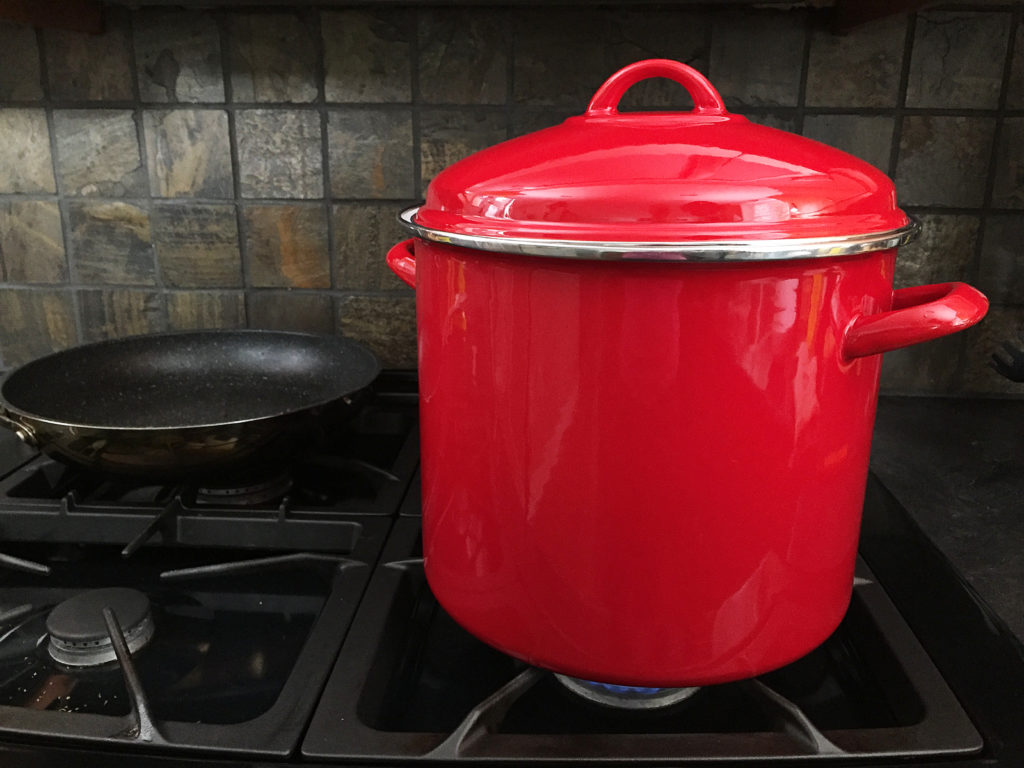 big red pot on stove