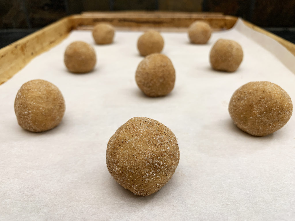 pumpkin snickerdoodle dough balls ready for oven