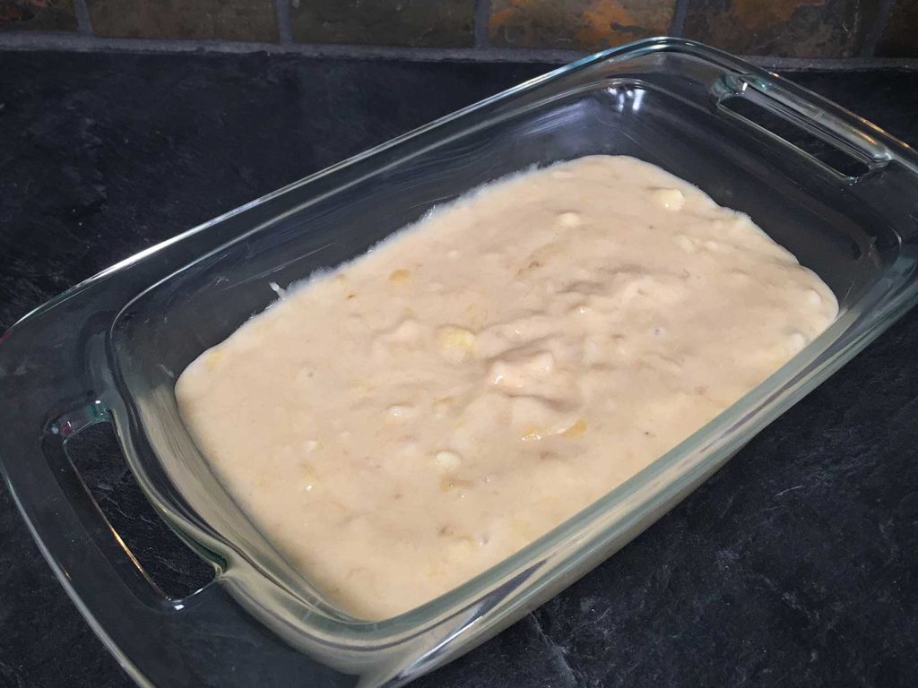 Banana bread batter in loaf pan