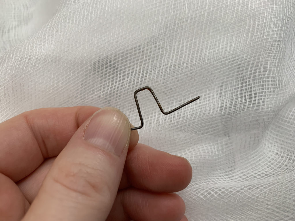 bending hair pin to use as a hook