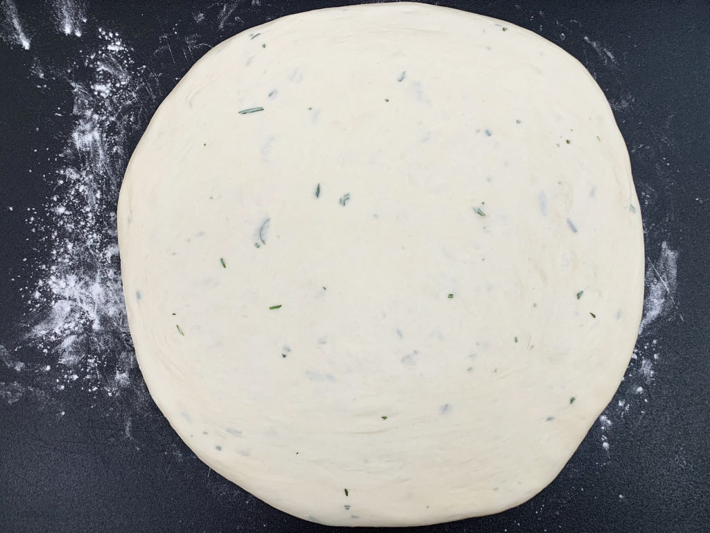 focaccia dough rolled out flat