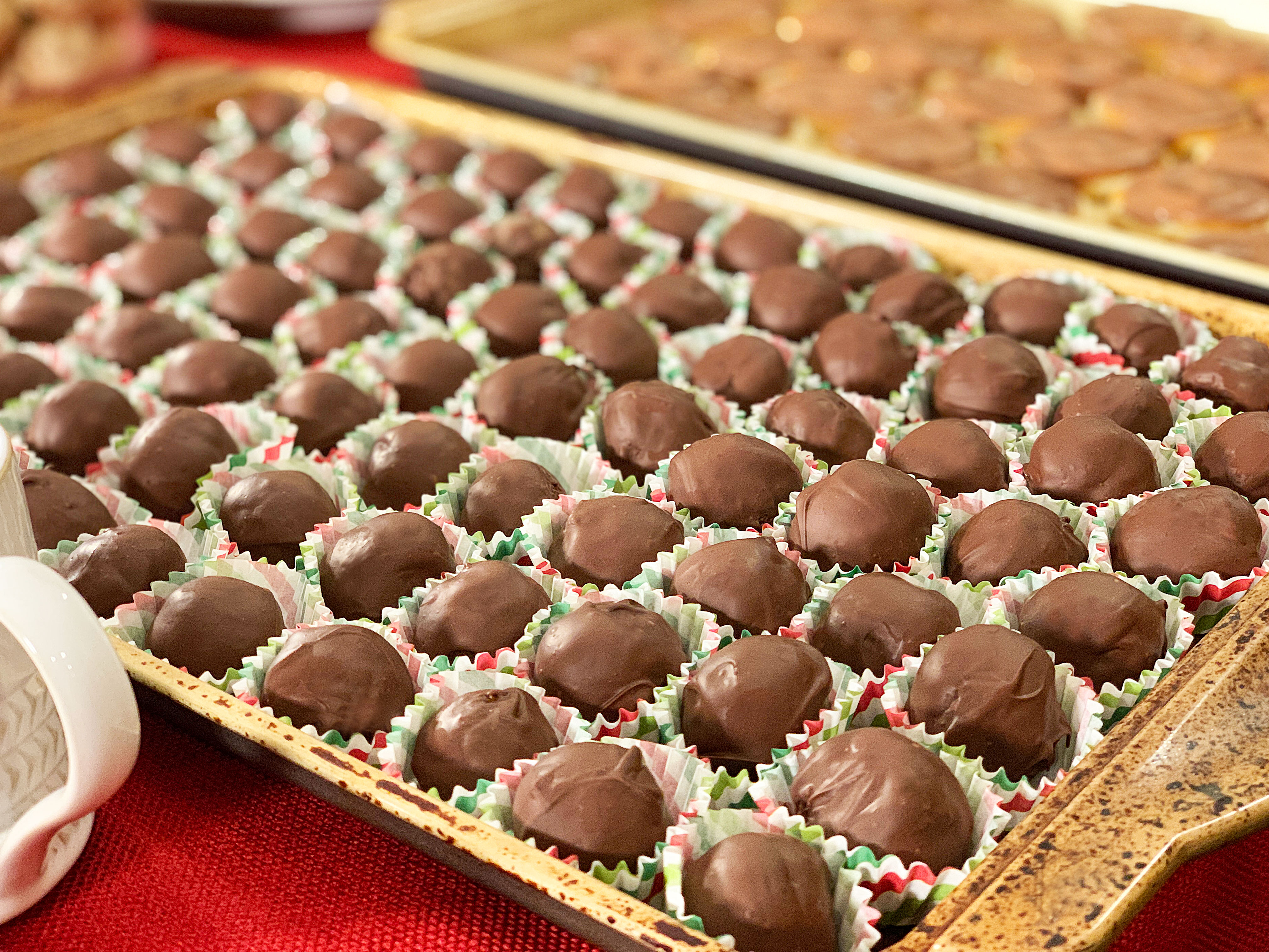 tray of chocolate covered bourbon balls in little paper cups