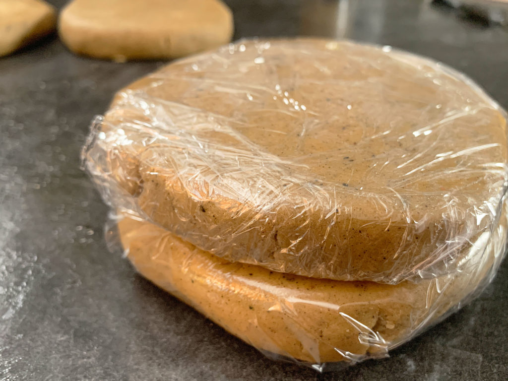 Dough shaped into discs and wrapped up, ready to chill in fridge