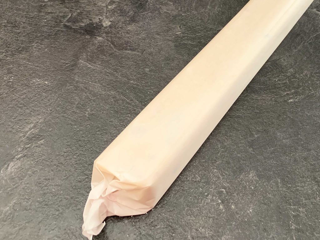 dough log wrapped in parchment