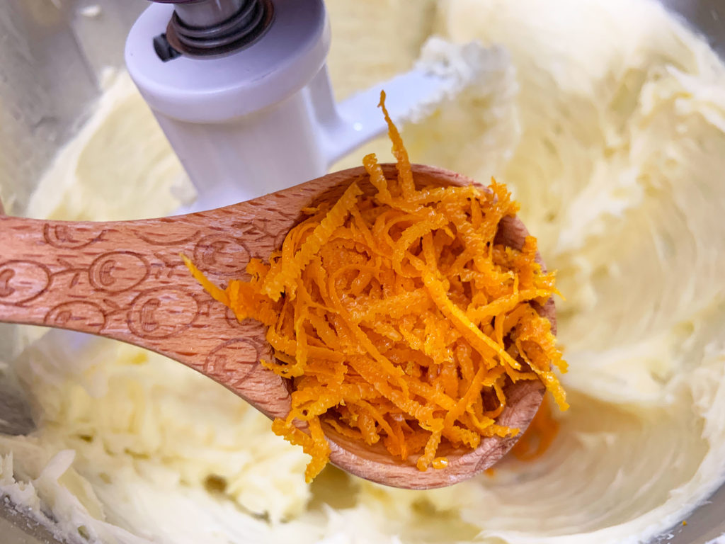 adding orange zest to the butter