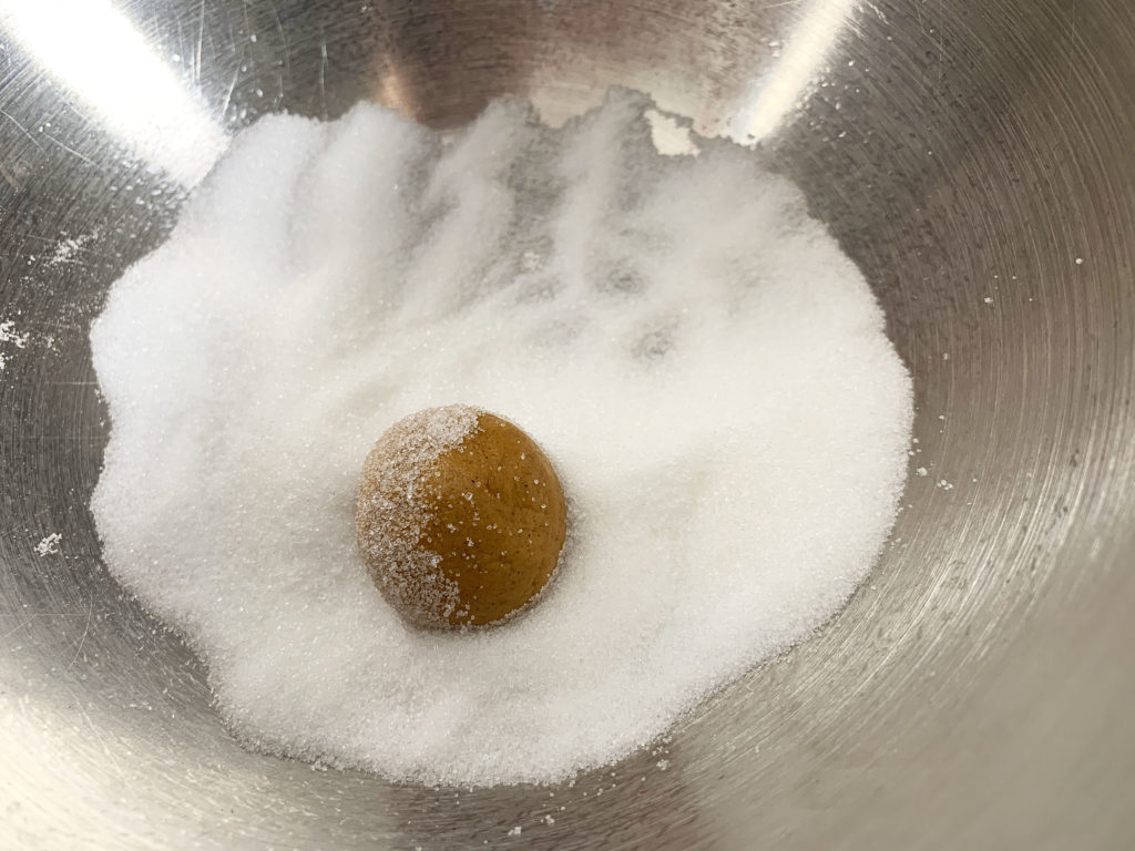 a dough ball, rolling in sugar