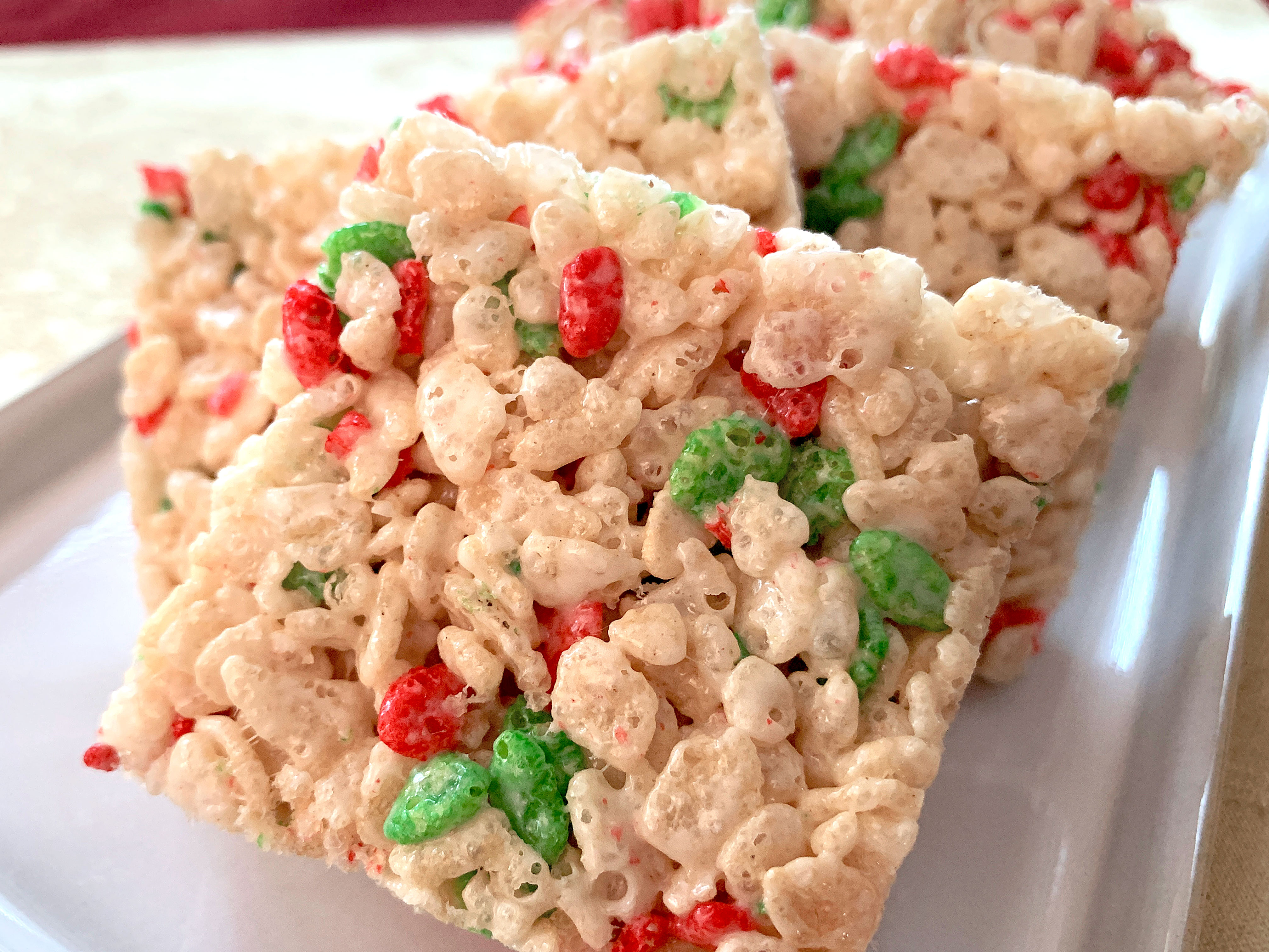 rice krispies cut into squares on a plate