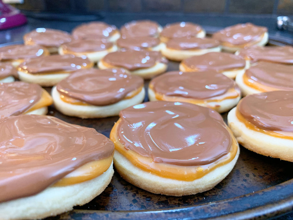 cookies covered in caramel and melted chocolate