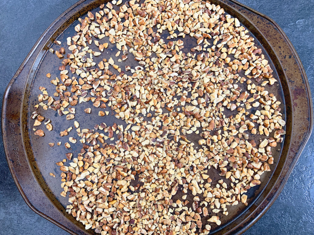 toasted walnuts on a tray
