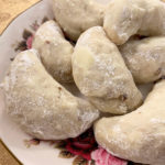 plate of walnut cardamom crescents