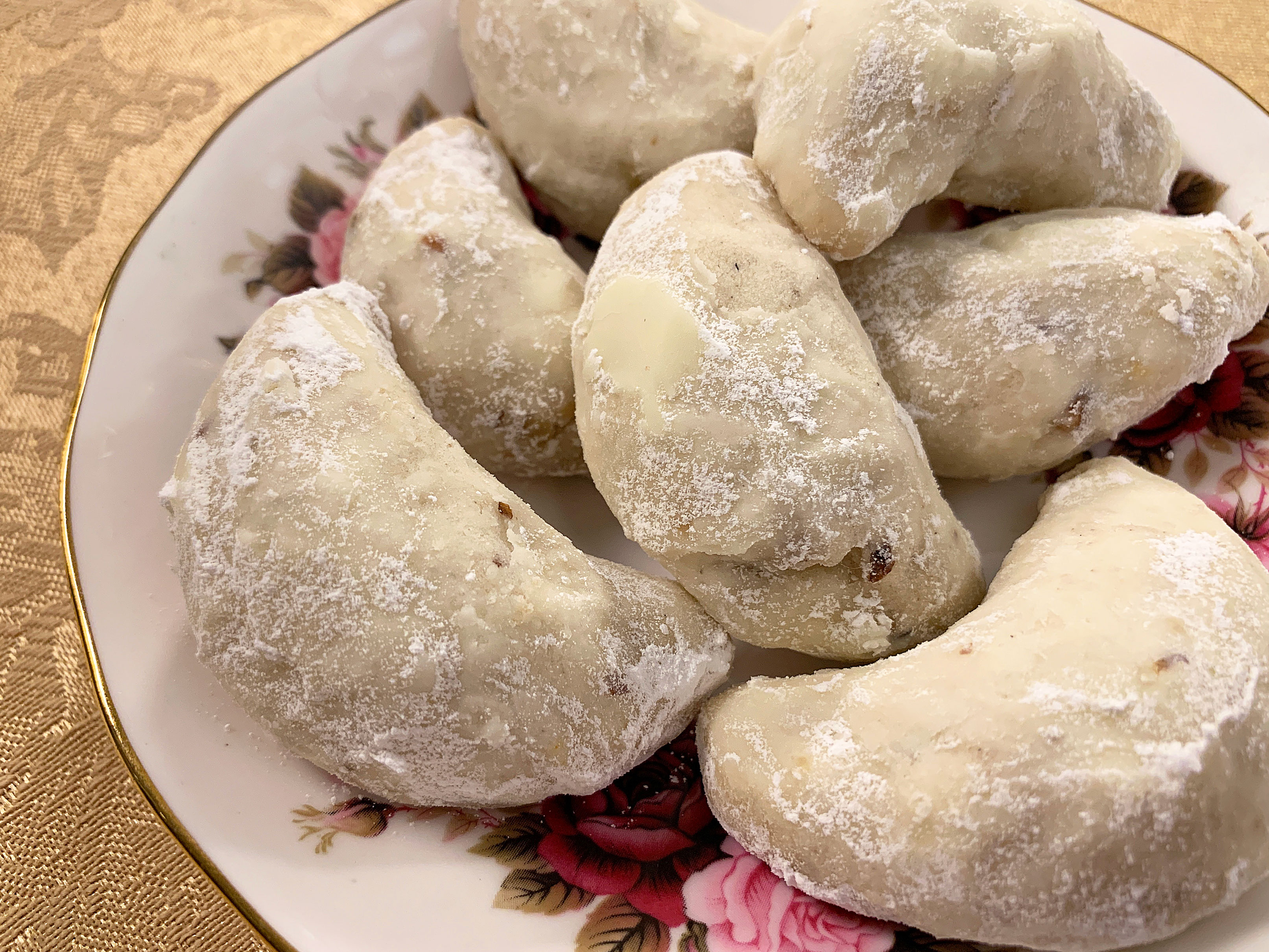 plate of walnut cardamom crescents