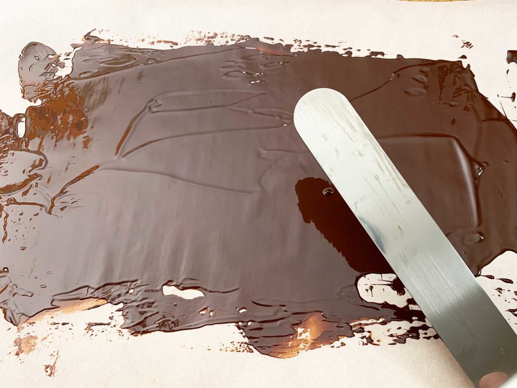 melted chocolate spread on a baking sheet