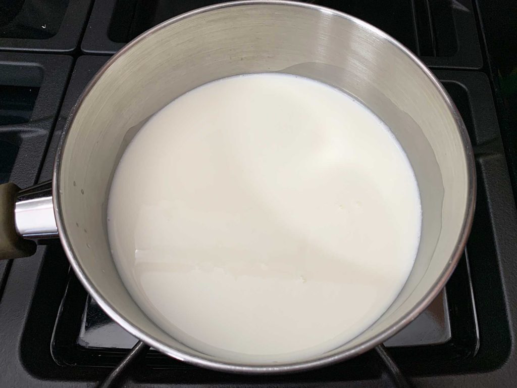 milk and sugar in a pot on stove