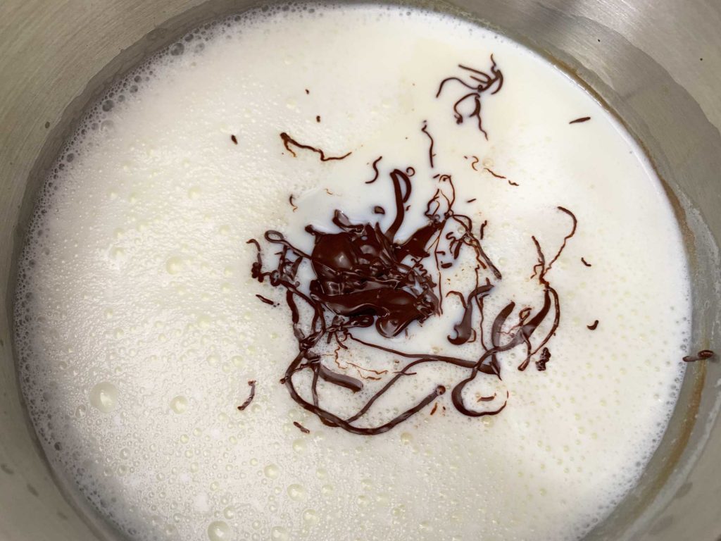 melted chocolate in hot milk