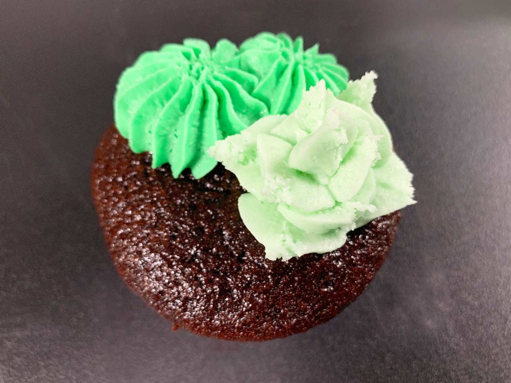 buttercream cactus on top of cupcake