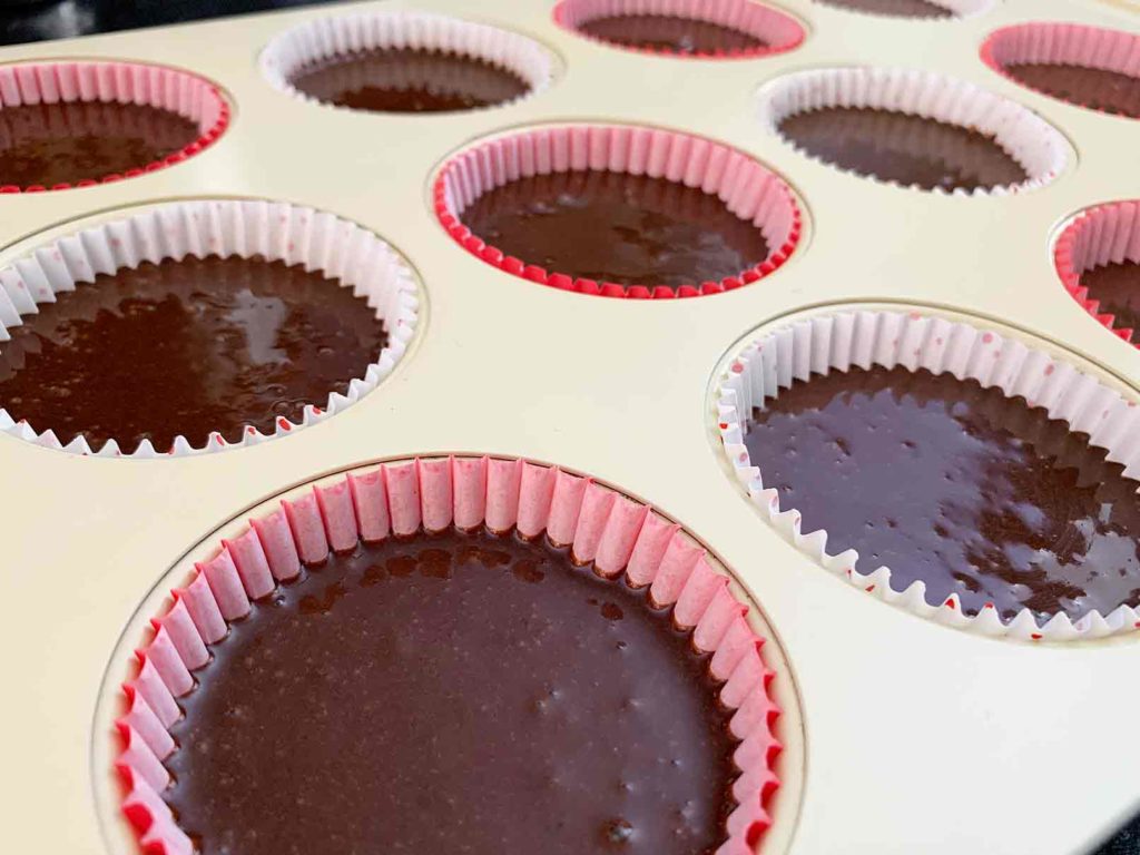 Chocolate cake batter in cupcake tin