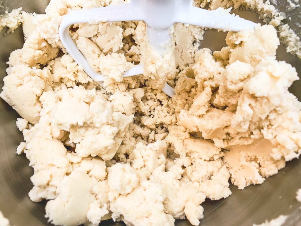 sugar cookie dough mixed up in mixing bowl