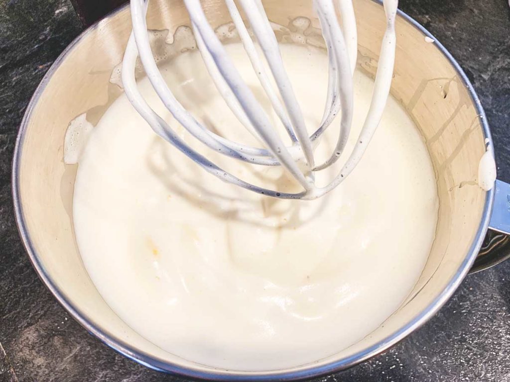 Sugar and egg mixed together in a stand mixer until very thick and fluffy