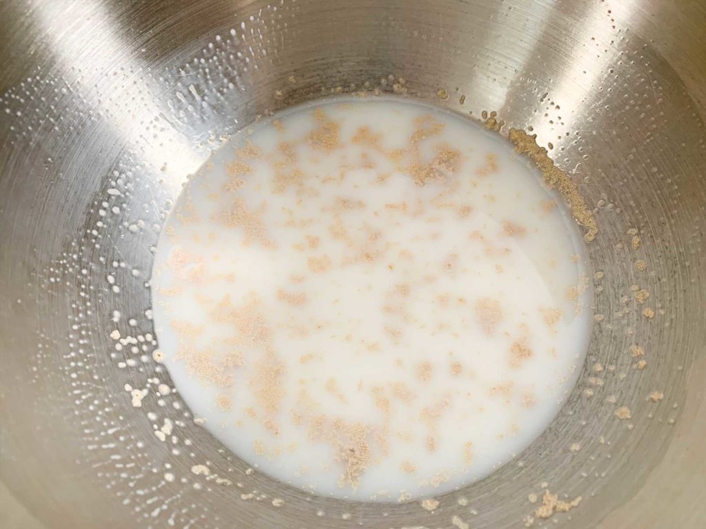 milk, water and yeast mixed together in bowl