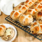 hot cross buns cooling on a wire rack