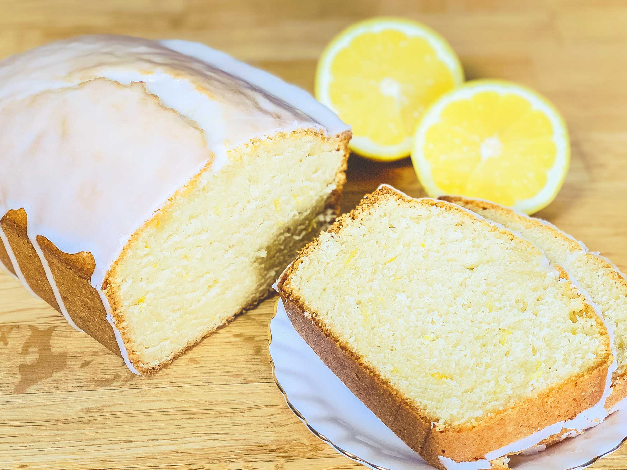 lemon loaf sliced on a plate