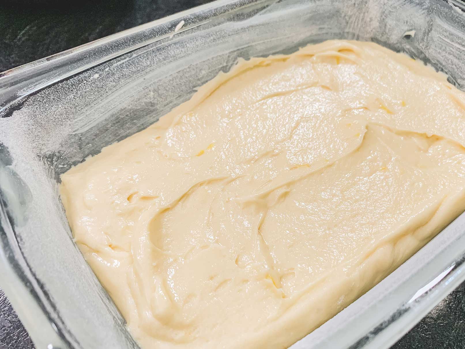 lemon loaf batter in pan, ready to go in oven