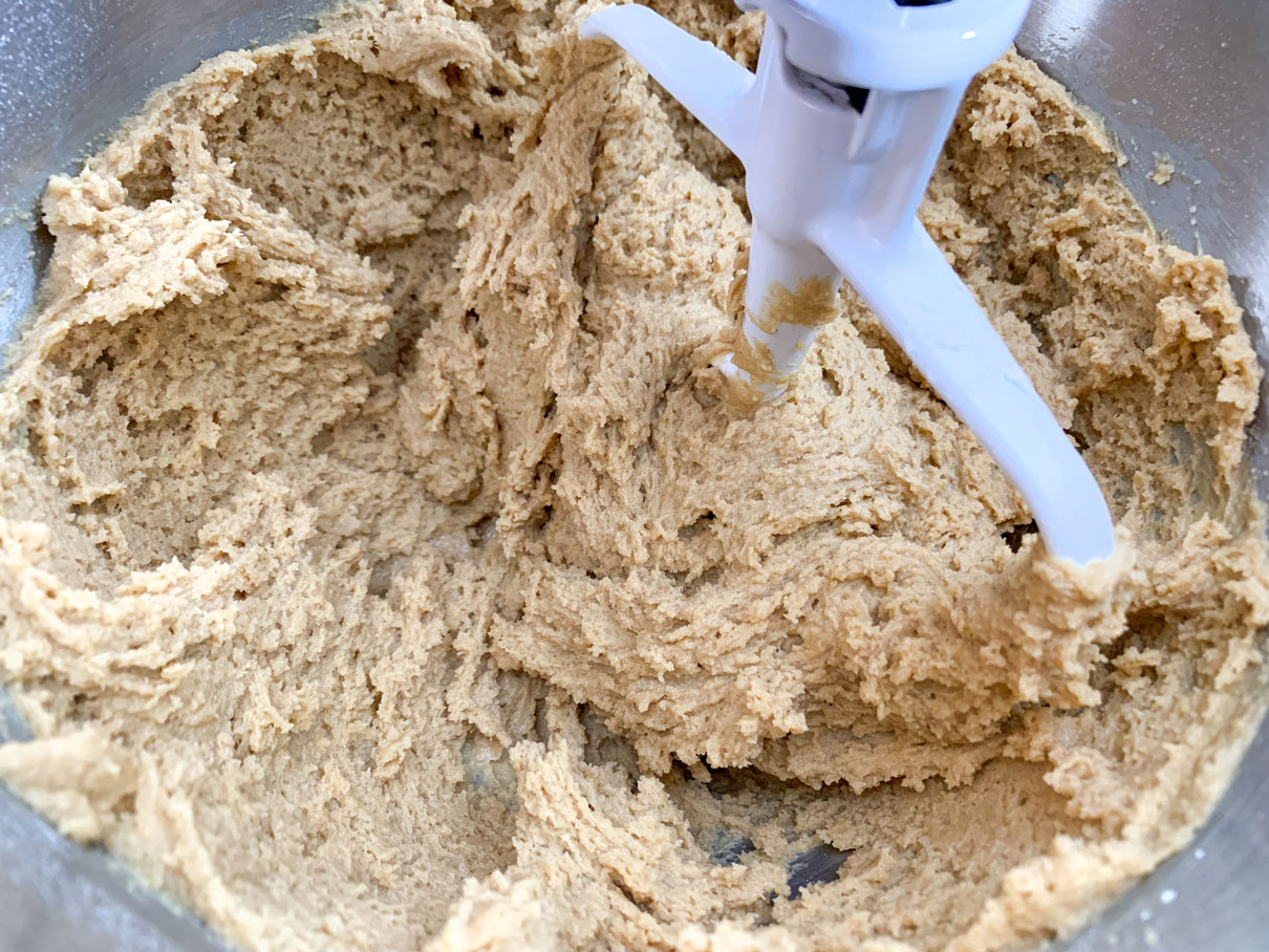 Peanut butter cookie dough mixed together in a mixing bowl