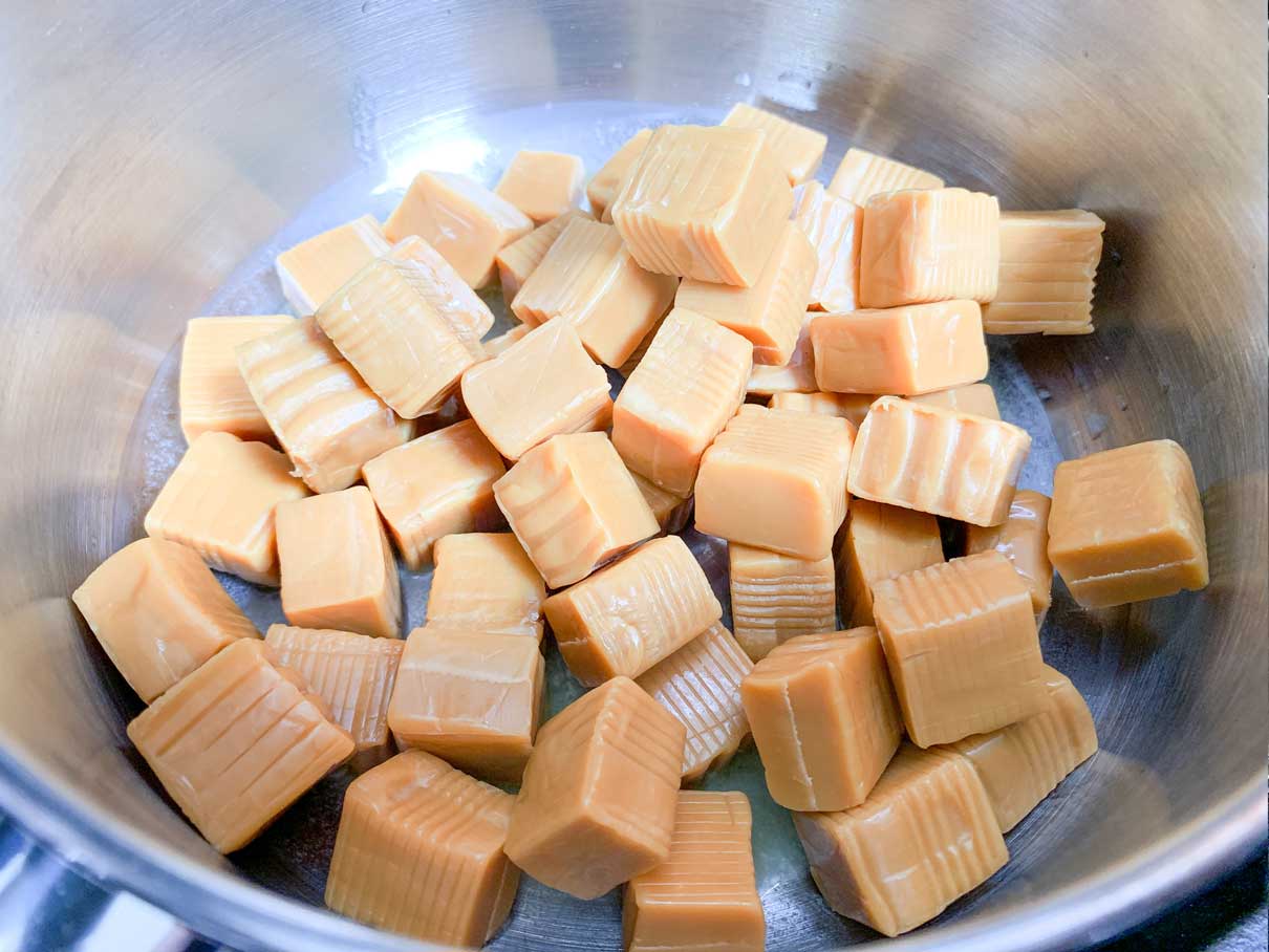 whole caramels in a saucepan
