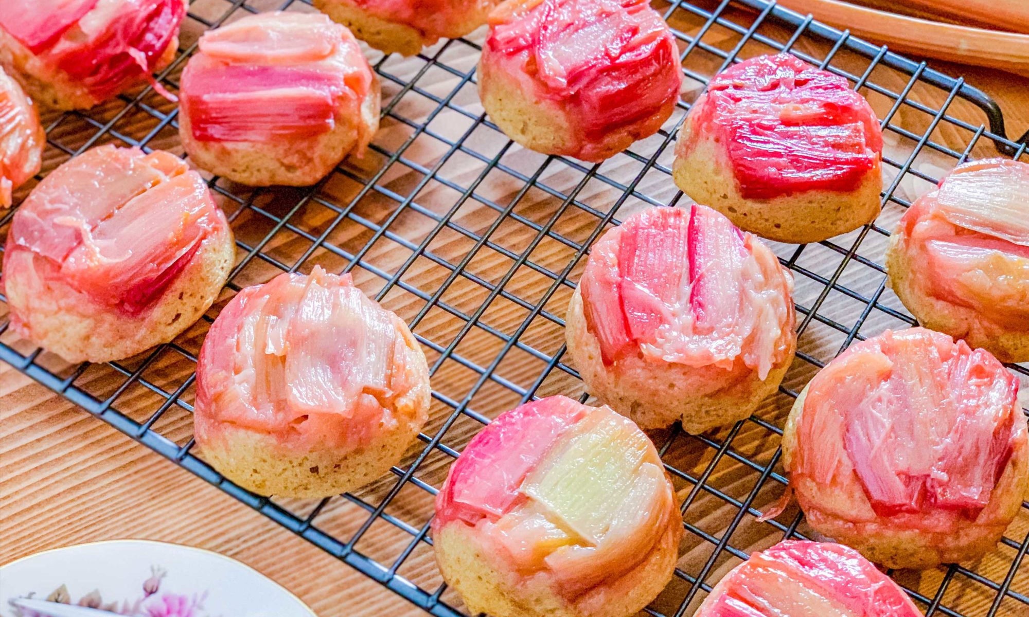 mini rhubarb cakes on a wire cooling rack