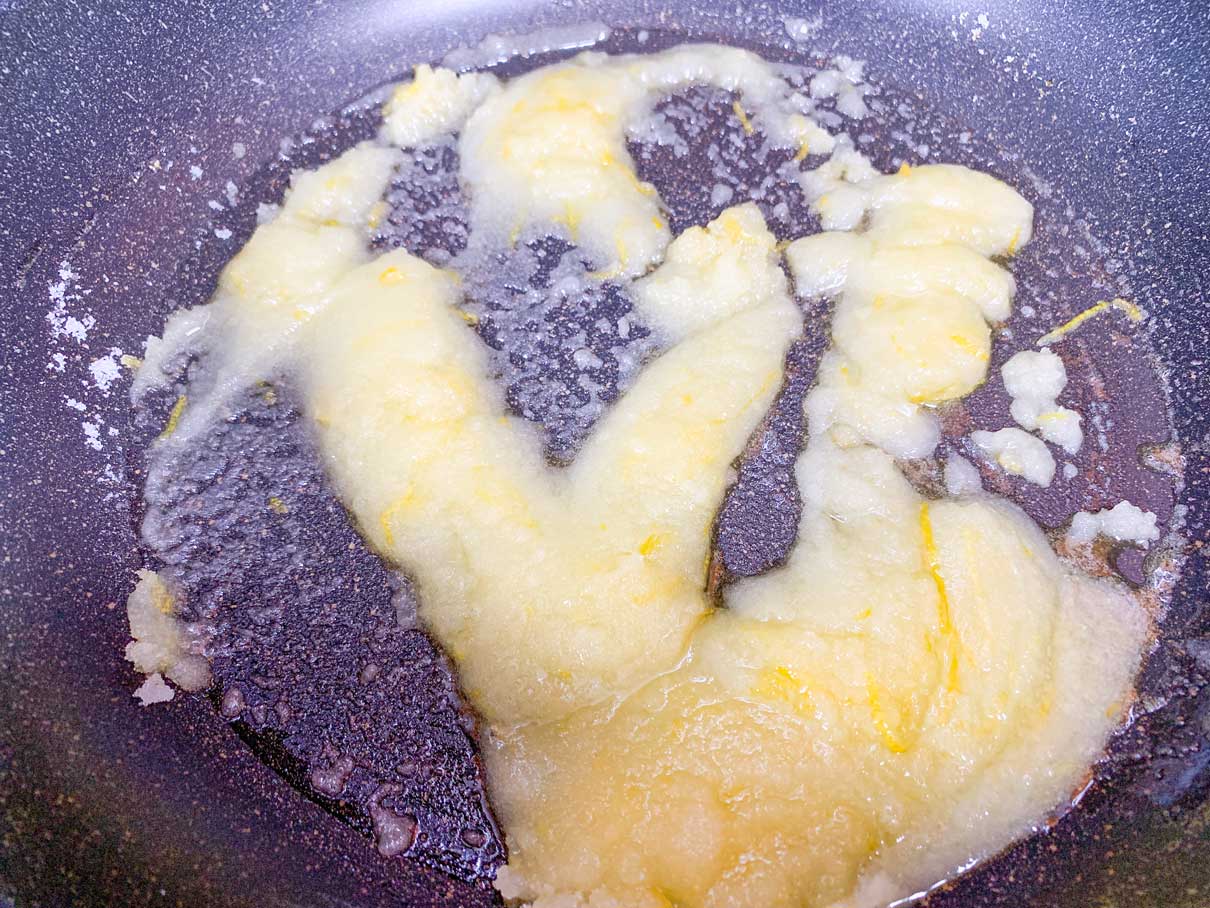 sugar, lemon zest, and butter melted together in a frying pan