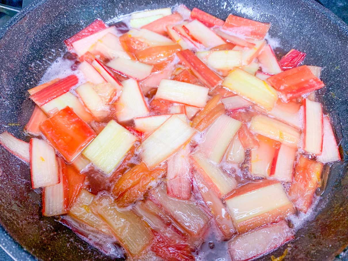rhubarb pieces cooking in frying pan with in lemon, sugar and butter