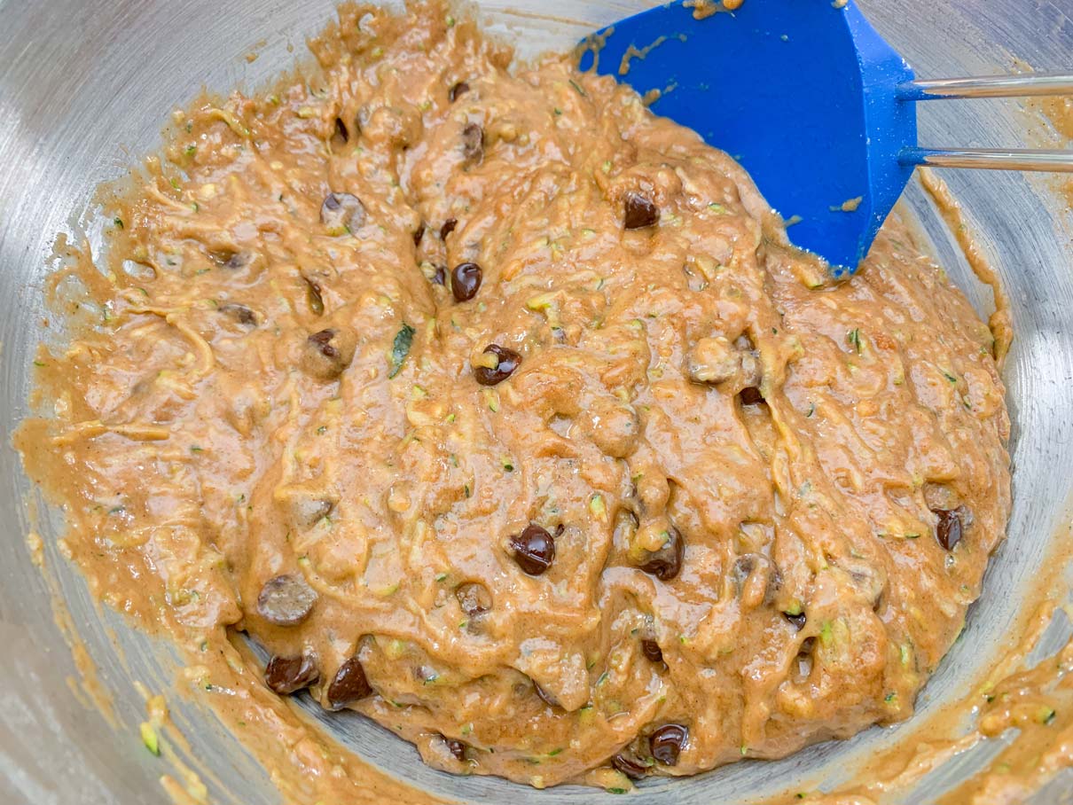 Zucchini batter with chocolate chips stirred in