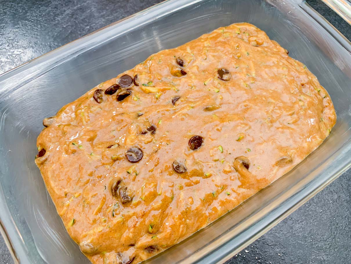 Zucchini loaf batter in a loaf pan, ready for the oven
