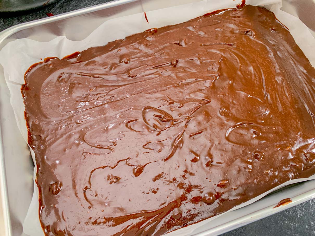 Brownie batter, spread in a 9 x 13 baking pan