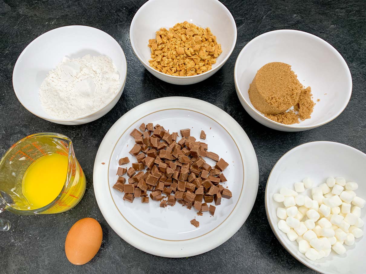 Smore's cookie ingredients measured out and in bowls
