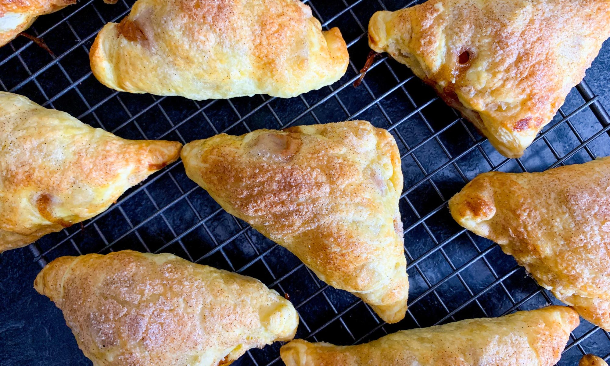 fresh baked apple turnovers, cooling on a wire rack