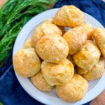 cheddar cheese and dill puffs on a plate