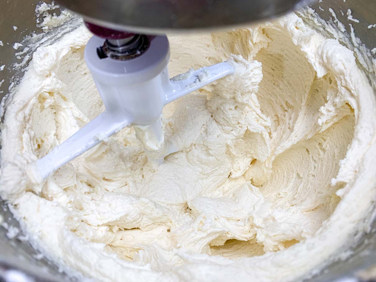 buttercream all mixed up in a mixing bowl