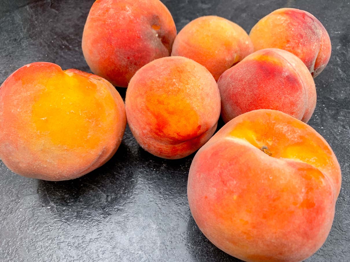 Fresh peaches, sitting on the counter