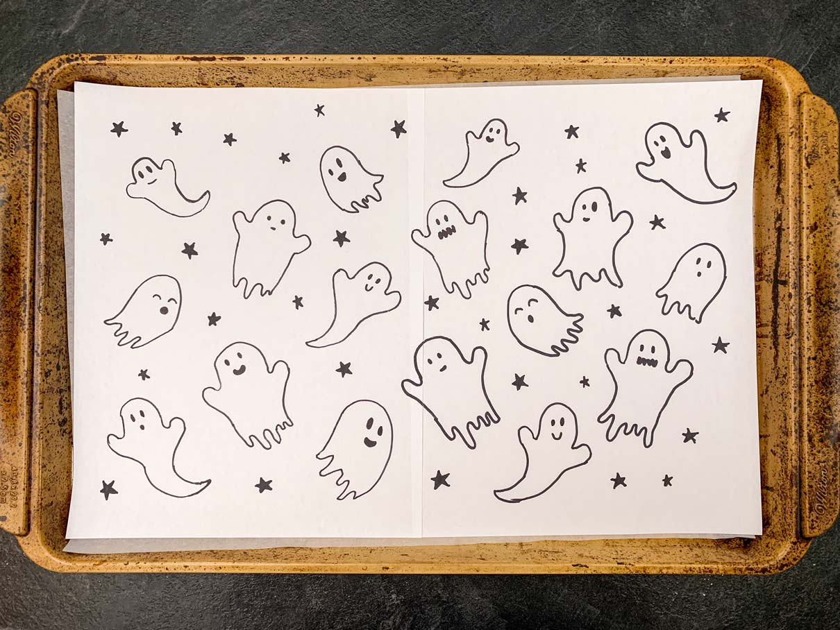 Paper on jelly roll pan with ghosts and stars drawn all over