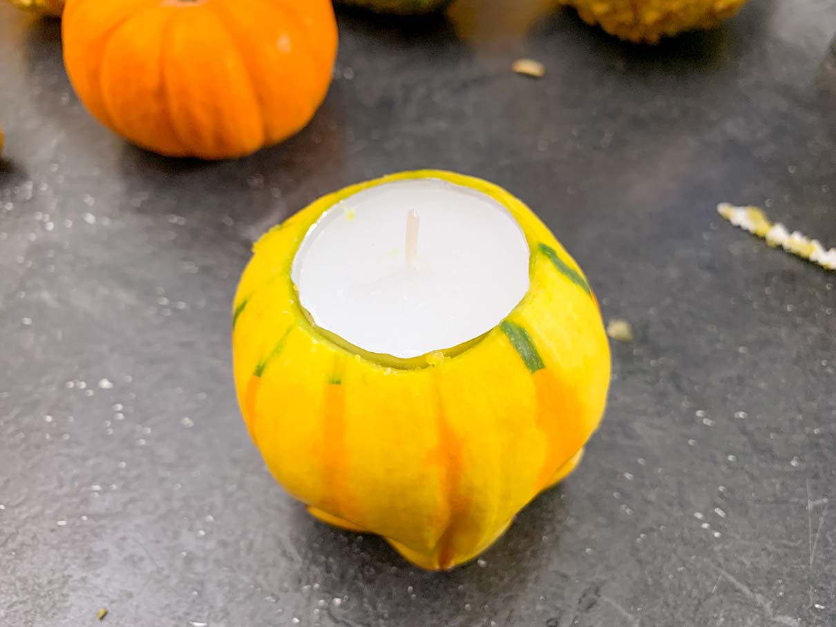 tea light placed into the gourd