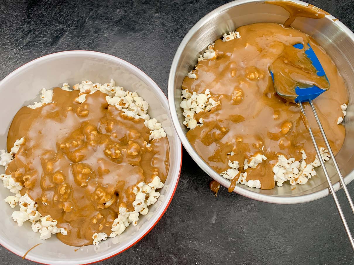 pouring the caramel over the popcorn