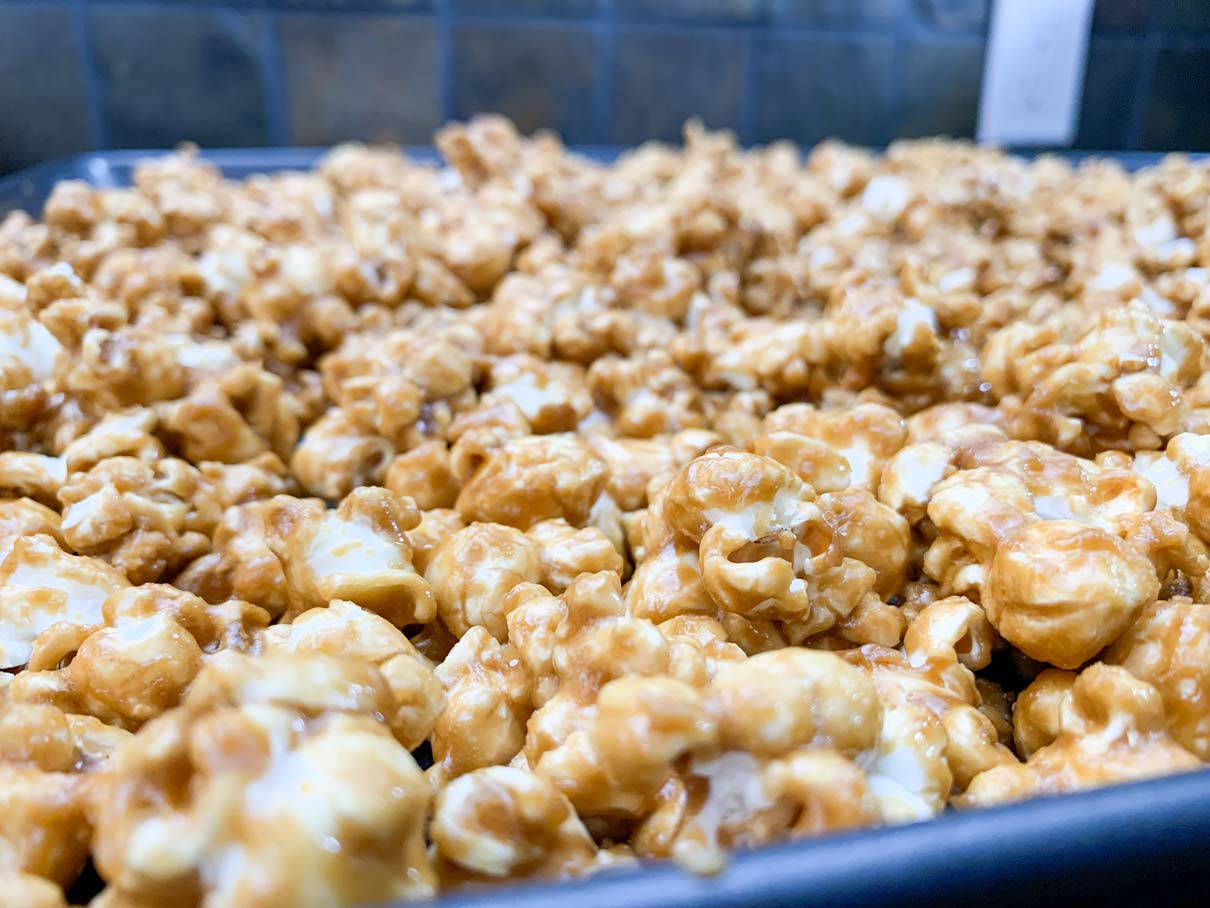 close up of the popcorn spread out into a baking pan