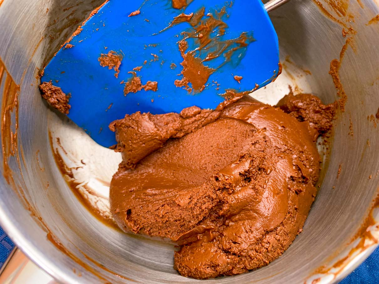 A lump of chocolate in a saucepan, that hasn't melted very well