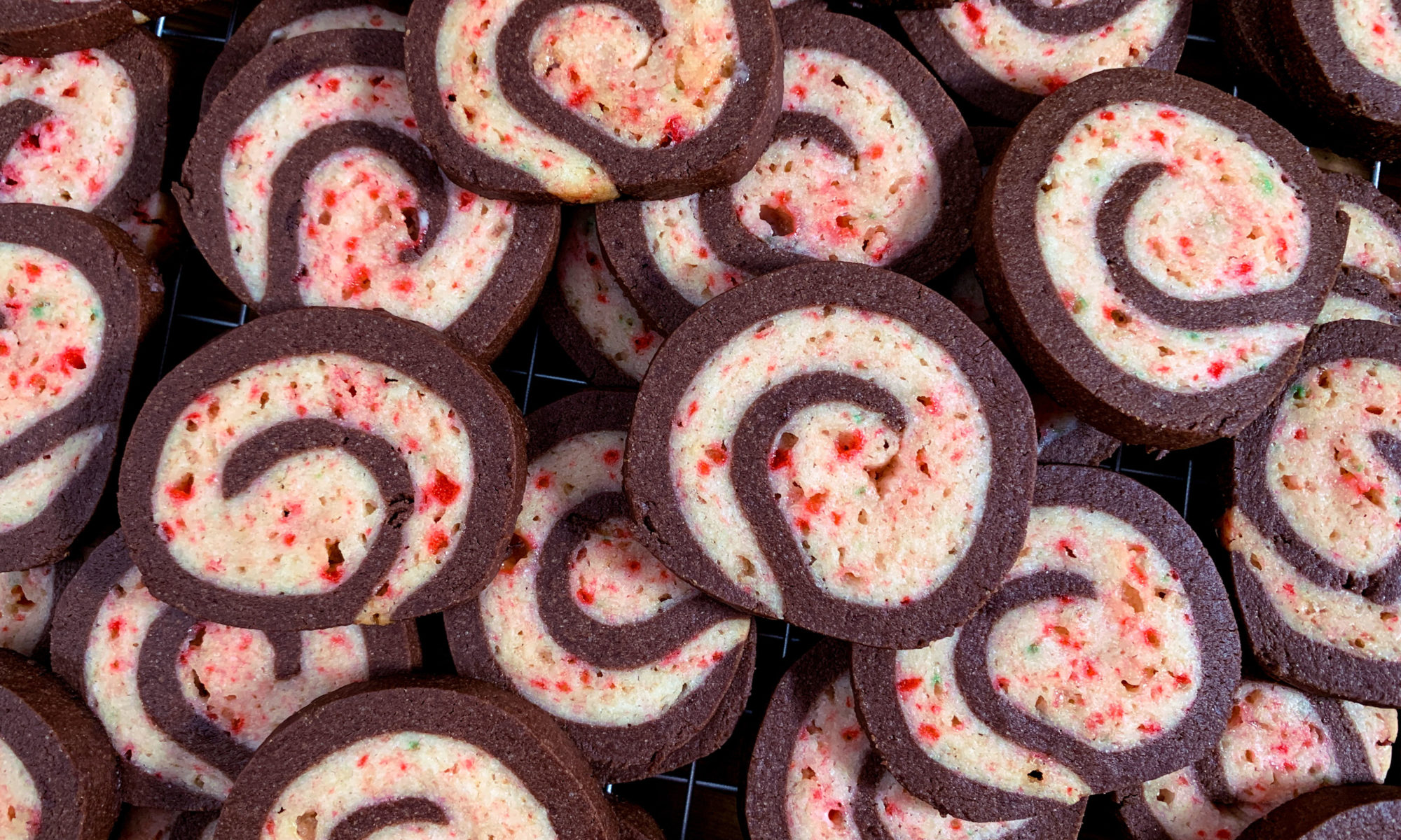 Pile of fresh baked chocolate peppermint pinwheel cookies