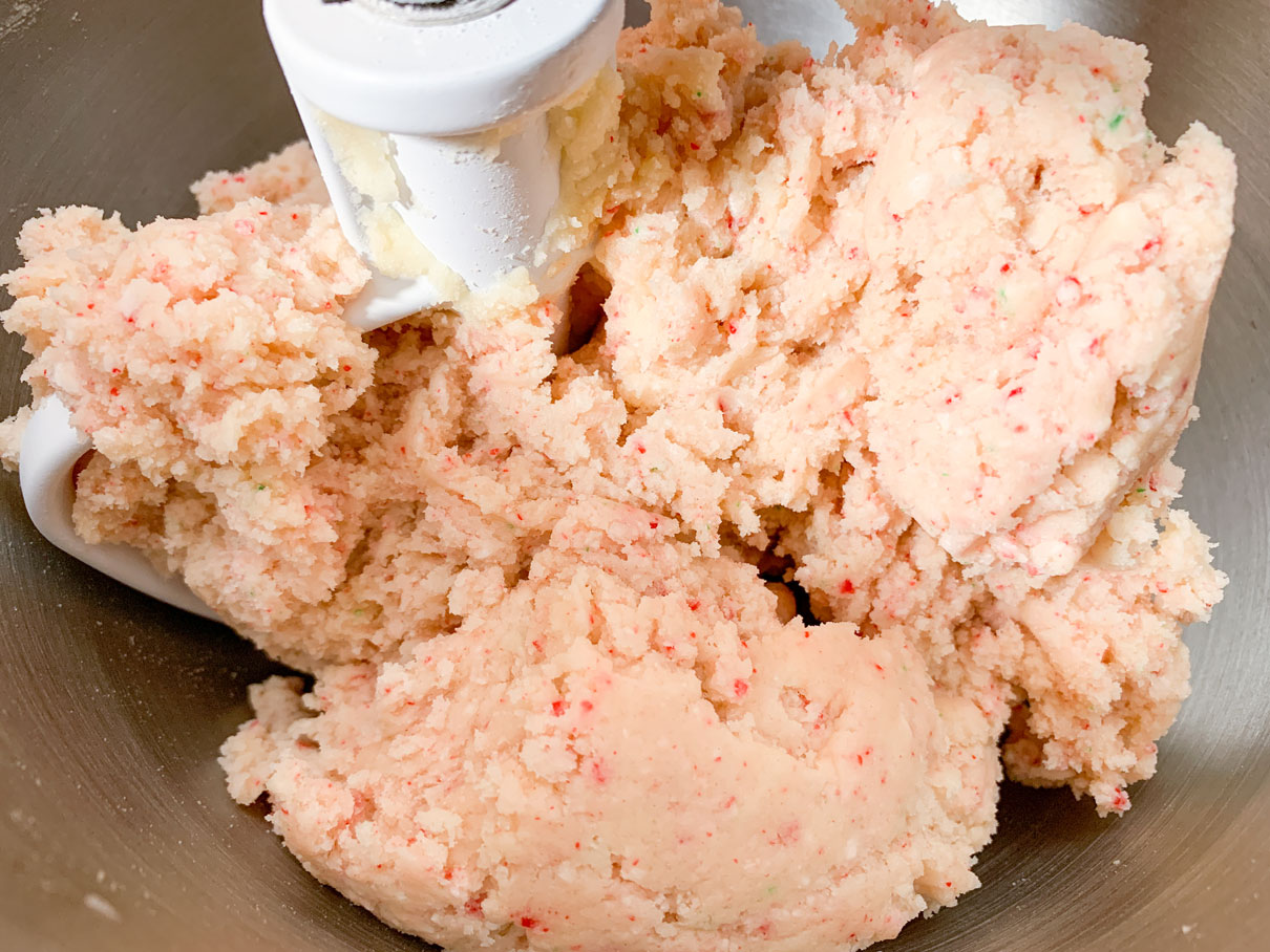 Candy cane dough mixed together in a bowl